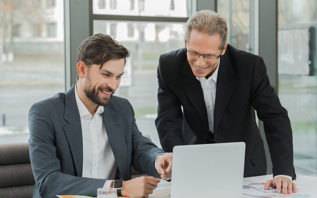 Business people looking at computer